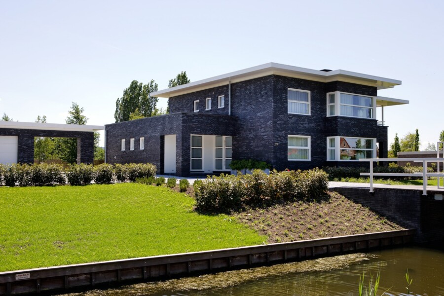 Moderne met glas versterkte gevel voor woningbouwproject Knipping